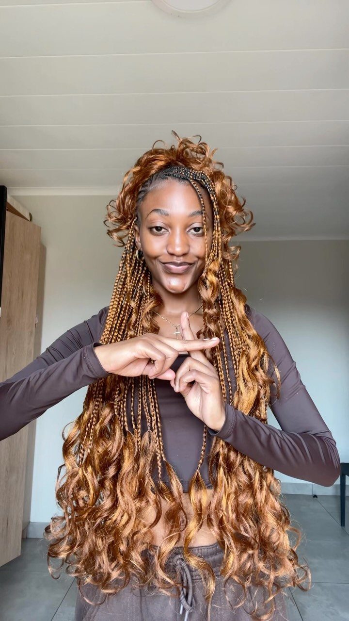 16 Homecoming Hair Curly Ideas: Buns, Braids, and Puffs 4 Woman with long reddish-brown hair featuring a mix of braids and loose curls.