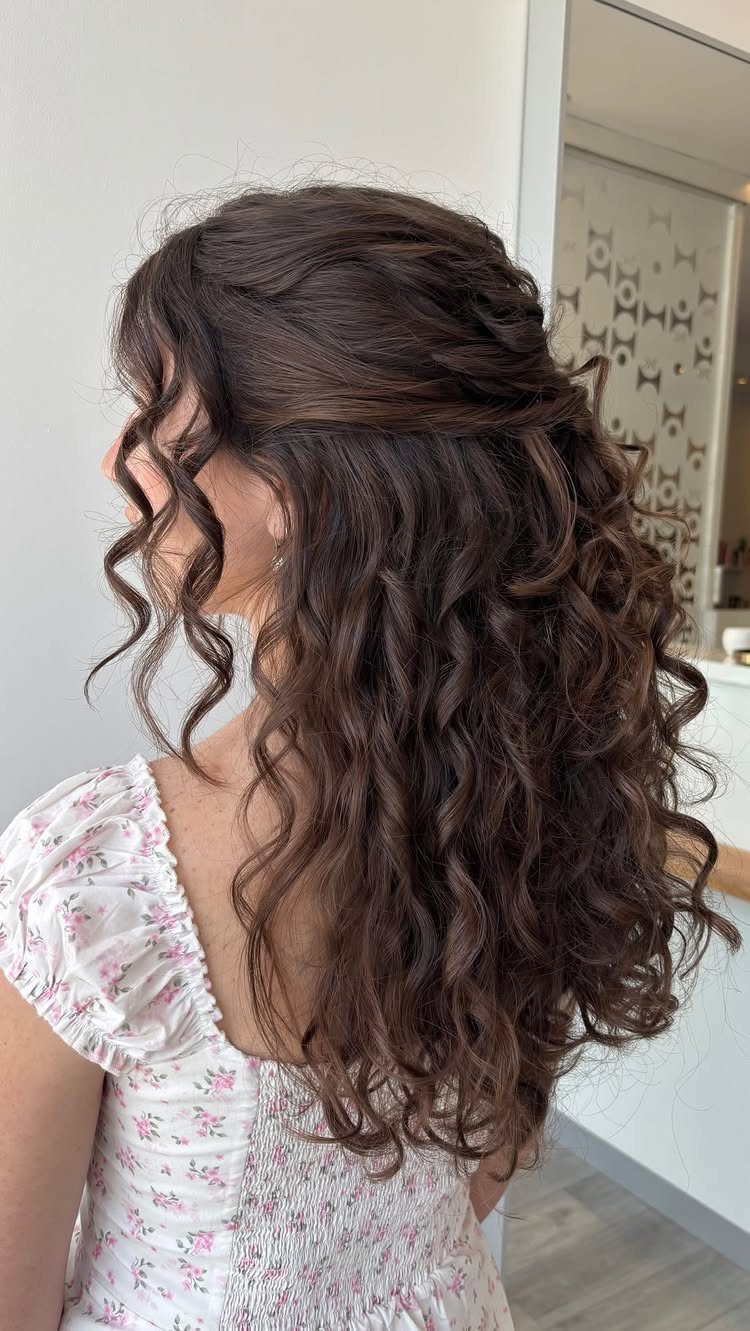 16 Homecoming Hair Curly Ideas: Buns, Braids, and Puffs 3 Long dark brown curly hair styled in a half-up, half-down hairstyle.