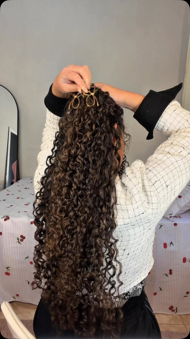 Long 3c Curly Hair Looks, Color and Updos: 15 Picks 6 Long brown curly hair with gold decorative hair pins being placed on top.