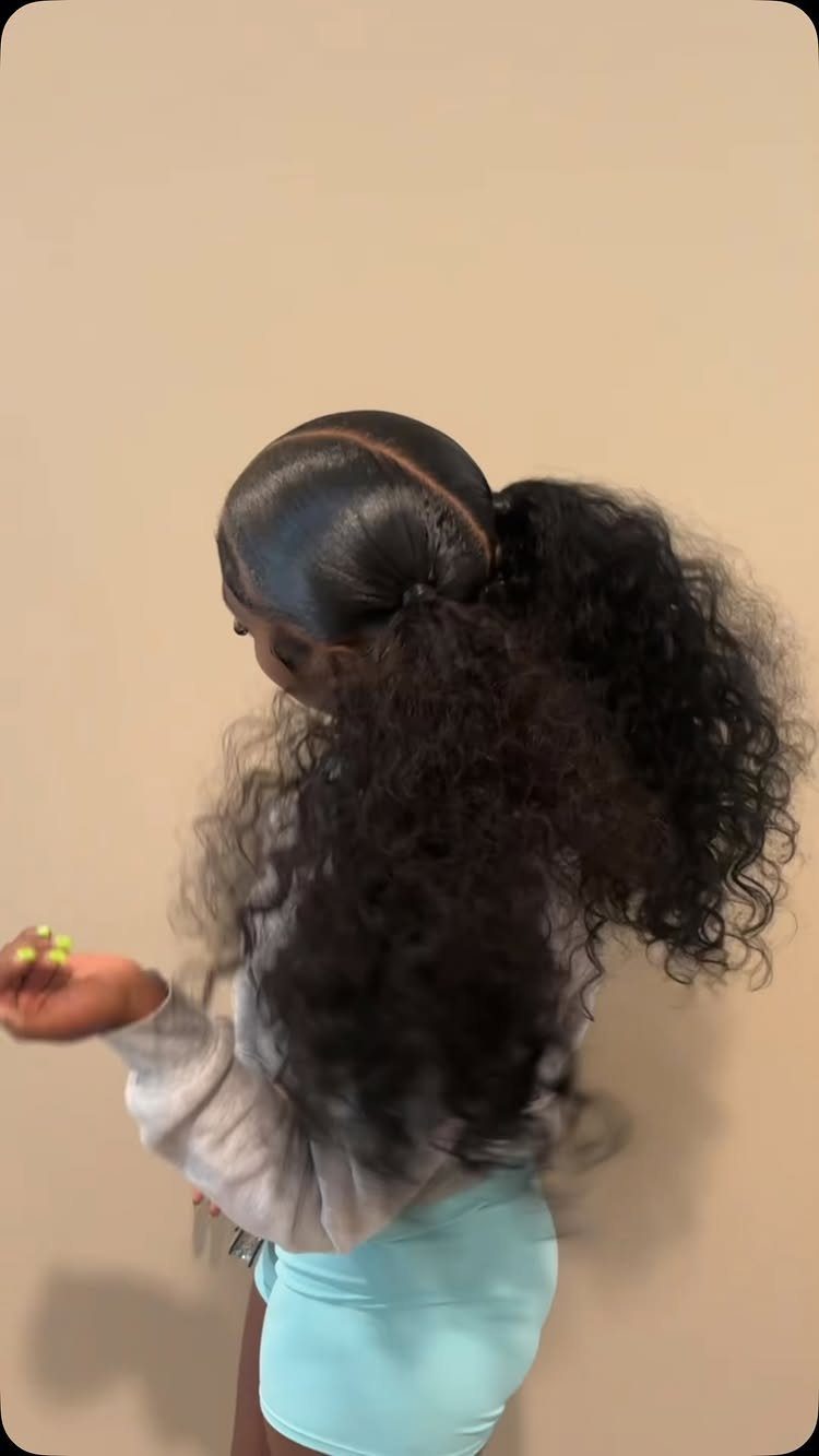 Long 3c Curly Hair Looks, Color and Updos: 15 Picks 12 Person with long dark 3c curly hair styled in a high ponytail.