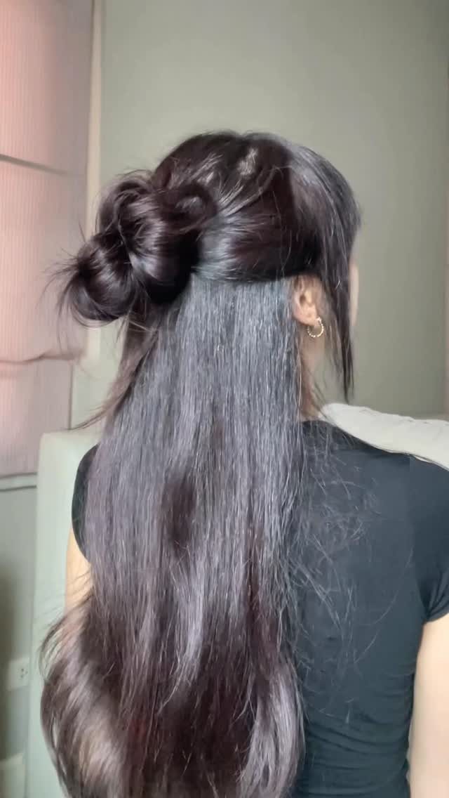16 Long Hair Hairstyles for Party Looks You Can Copy 6 Long dark hair styled in a half-up bun with straight hair flowing down.