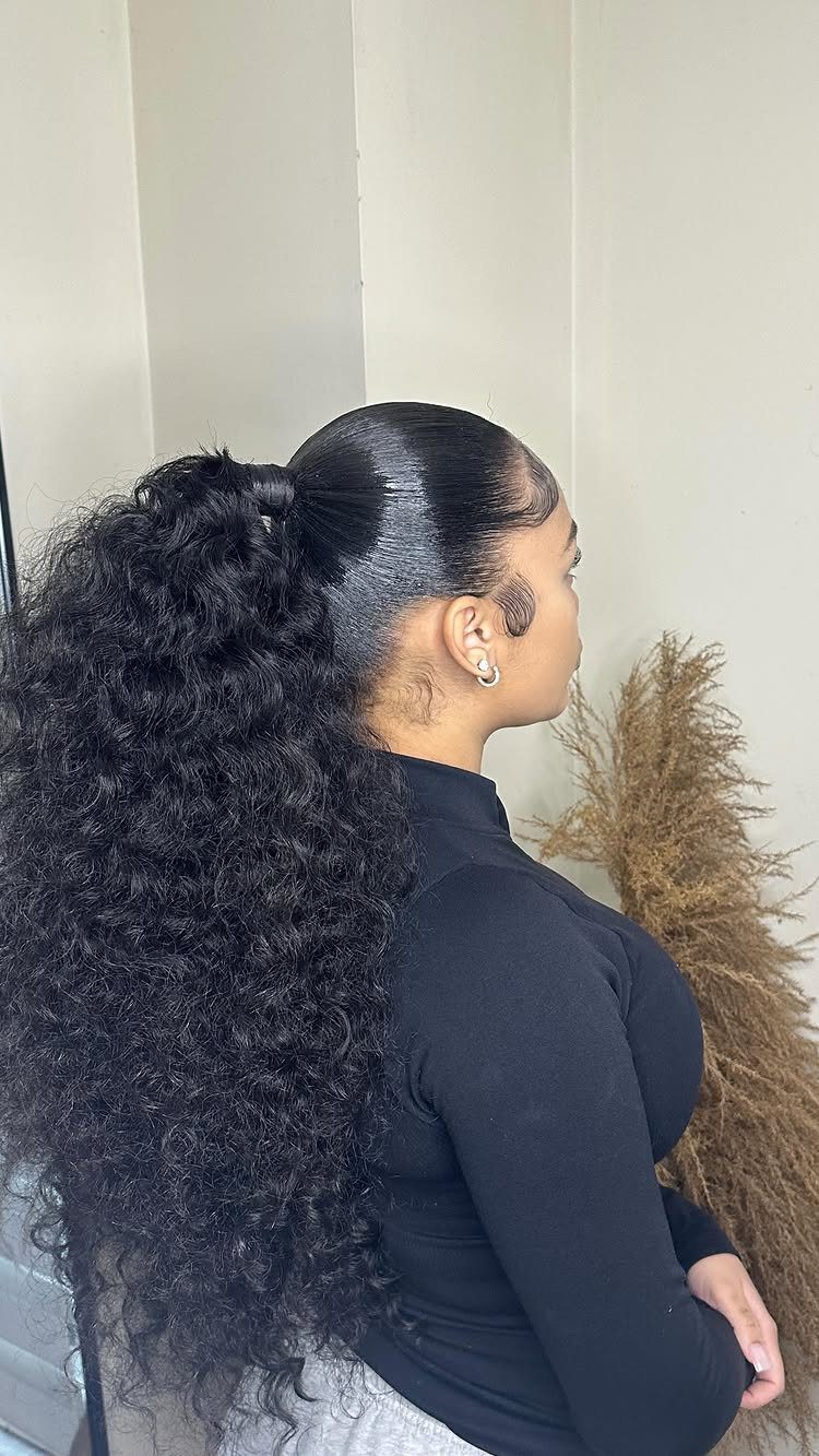 16 Long Hair Hairstyles for Party Looks You Can Copy 9 Woman with long curly black hair styled in a high, voluminous ponytail.