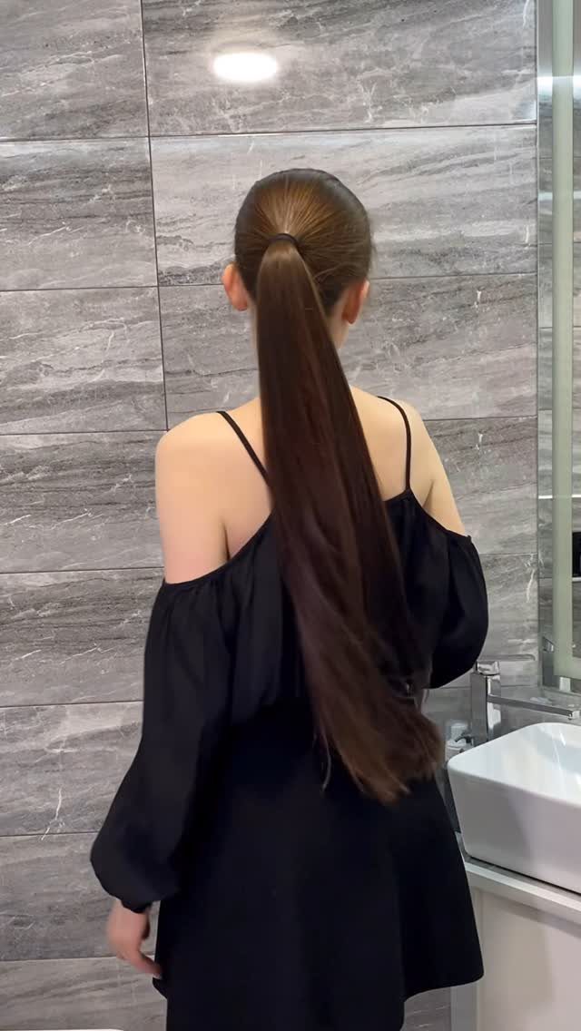16 Long Hair Hairstyles for Party Looks You Can Copy 15 Woman with long brown hair tied in a high sleek ponytail wearing black dress