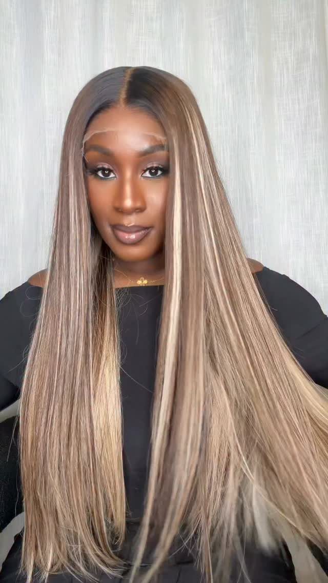 16 Long Hair Hairstyles for Party Looks You Can Copy 1 Woman with long, sleek, straight blonde and brown highlighted hair wearing black top