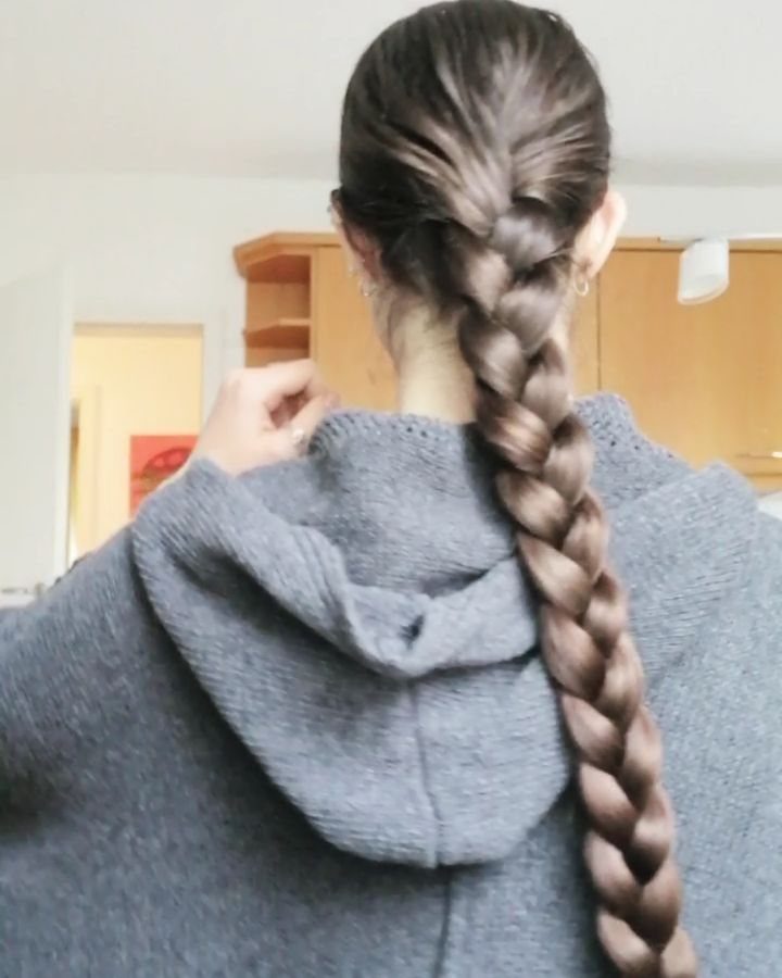 20 Long Hair Hairstyles for Work, From Buns to Braids 20 Long brown hair styled in a neat braid over a grey hooded sweater
