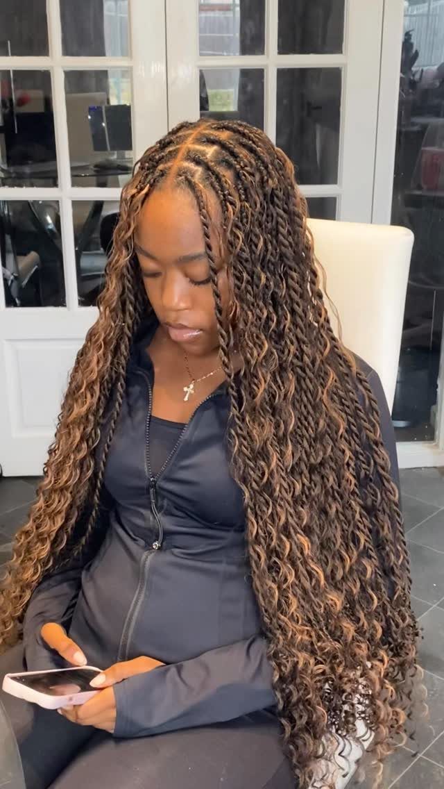 Long Hair Without Layers: 9 One-Length Styles to Try 1 Woman with long brown curly hair and caramel highlights styled in braids.