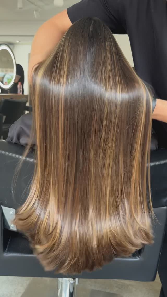 Long Hair Without Layers: 9 One-Length Styles to Try 9 Long straight brown hair with golden highlights and a blunt cut without layers