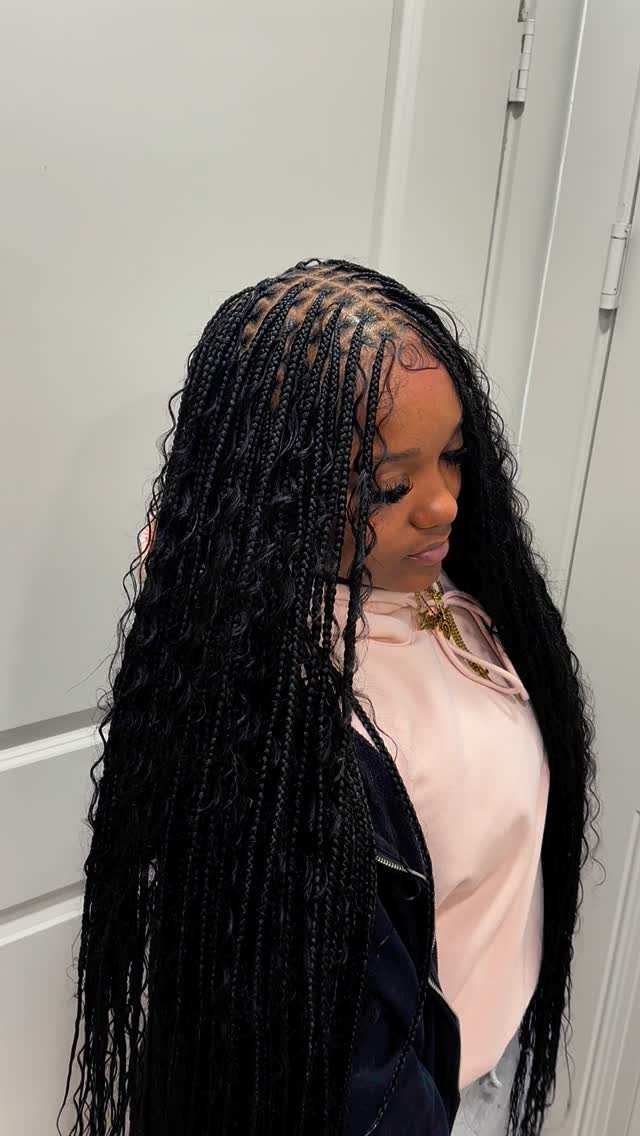 11 Long Loose Hair Ideas for Every Style and Texture 5 Woman with long black braids that flow into soft, loose wavy ends.