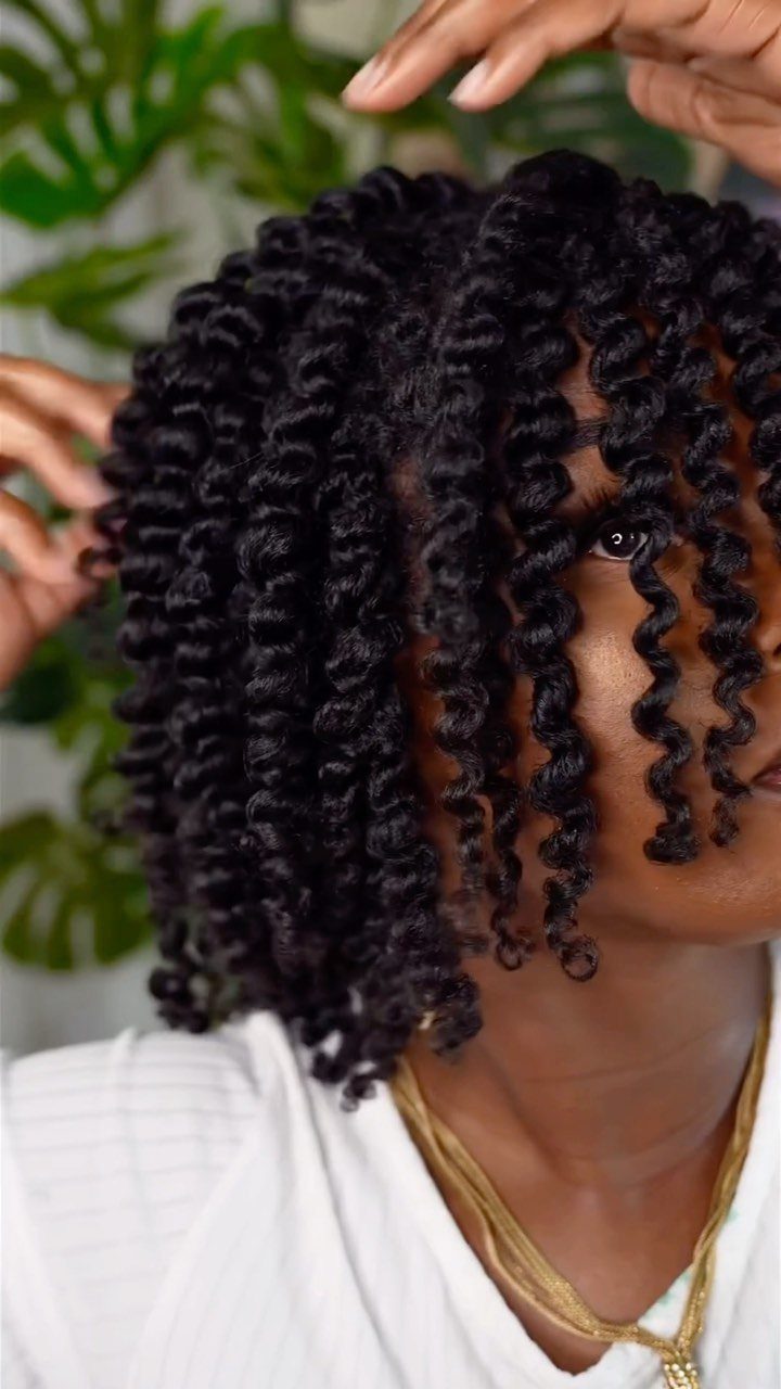 17 Natural Curly Hairstyles for Short Hair You Can Wear 10 Person with short, defined spiral curls styled in a twist-out hairstyle.