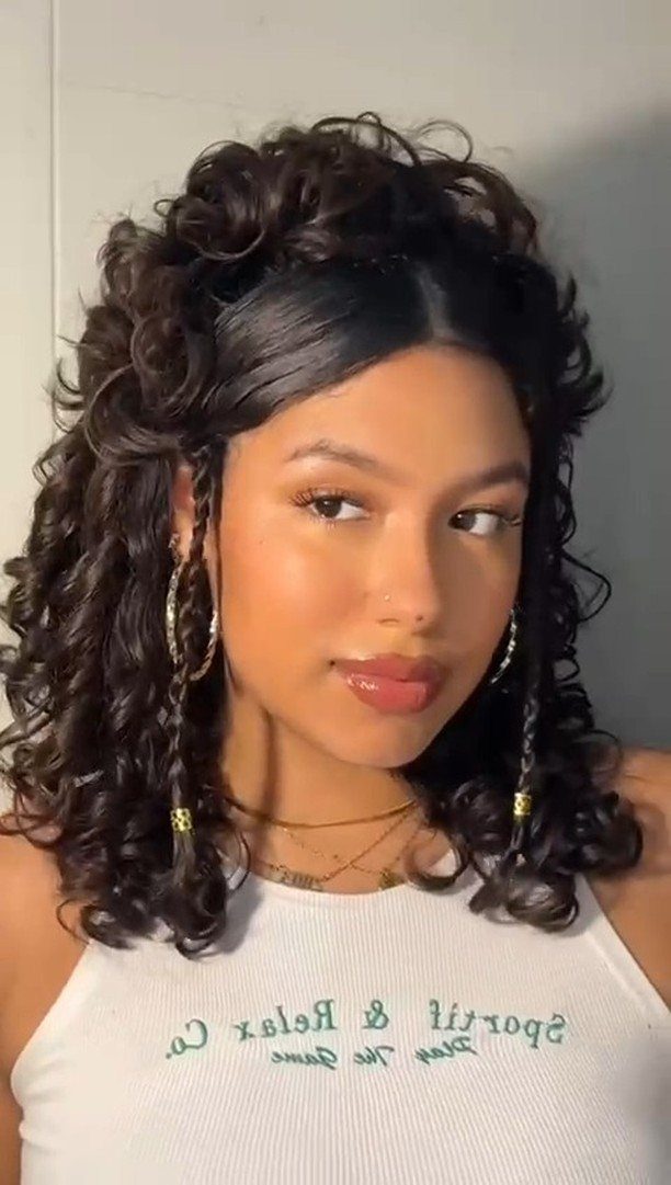 Naturally Curly Prom Hairstyles: 4 Ideas to Try 1 Young woman with curly dark hair in a half-up, half-down hairstyle and gold jewelry.