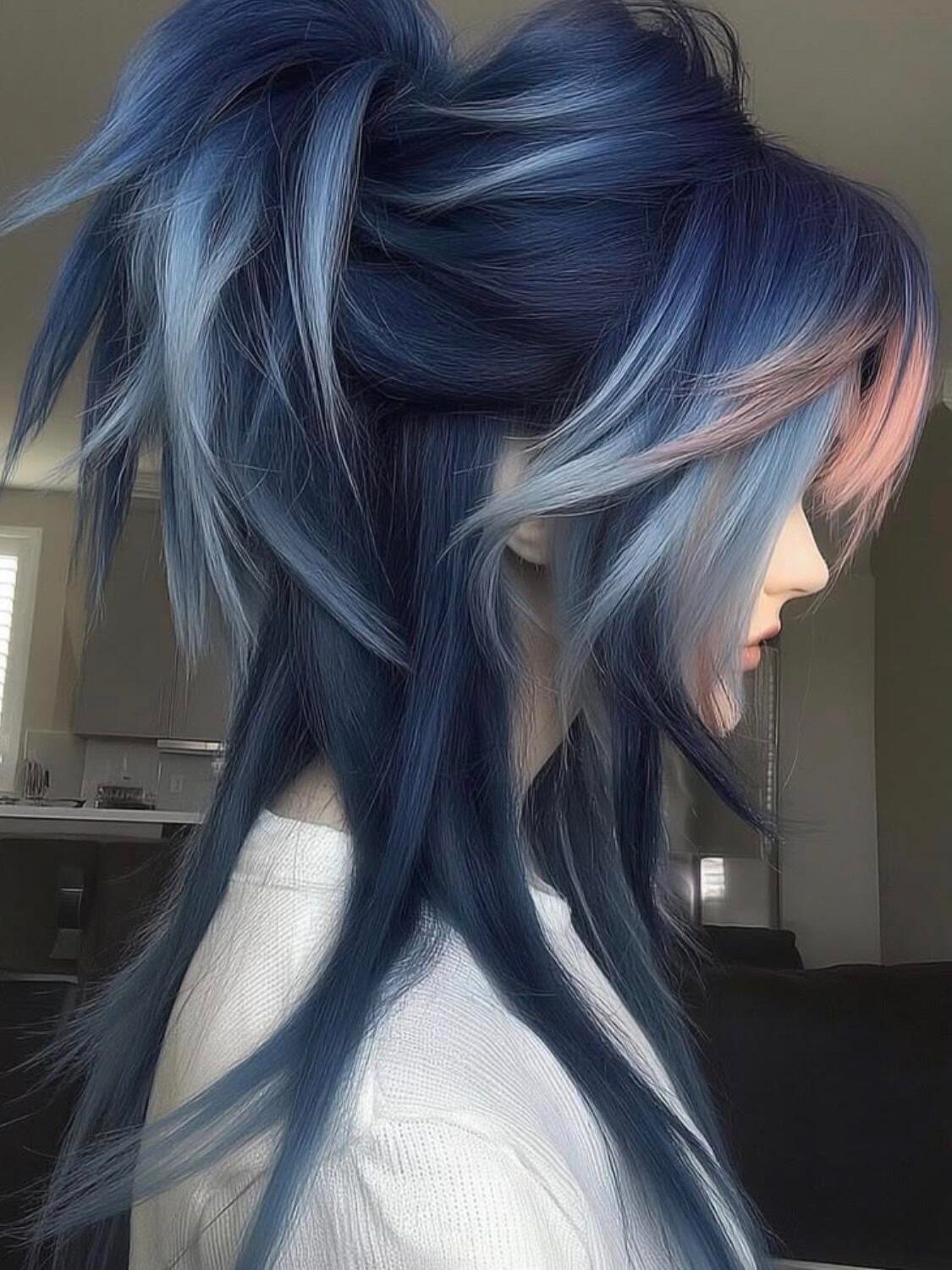 Neapolitan Hair Blue: 5 Ideas for Streaks and Peekaboos 5 Multi-toned hair in navy, light blue, and pink styled in a high ponytail.