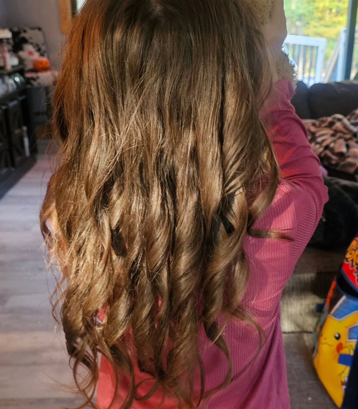 11 Picture Day Hair Ideas for Kids, from Braids to Bows 2 Long light brown hair with tight curls at the ends on a child