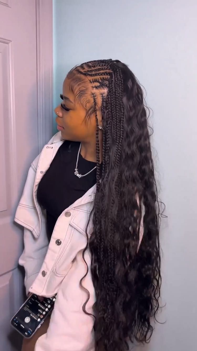 Quick Weave Styles with Braids: 18 Cornrow and Updo Ideas 16 Woman with long wavy hair and cornrow braids along the side of her head.