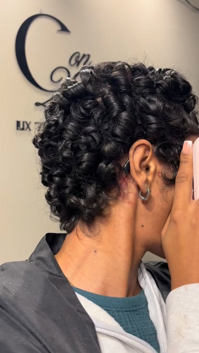 21 Short Curly Hair Styling Ideas for Every Texture 1 Person with short, tight black curls in a pixie cut side profile view