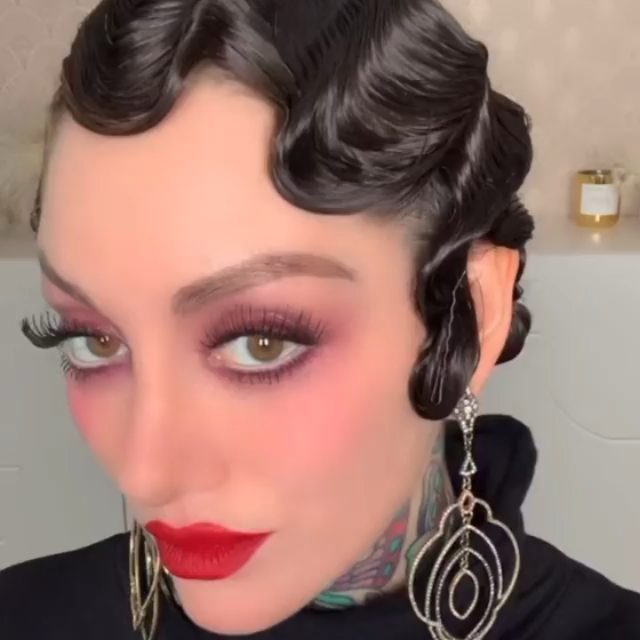 21 Short Curly Hair Styling Ideas for Every Texture 14 Woman with short black hair styled in retro finger waves and red lipstick.