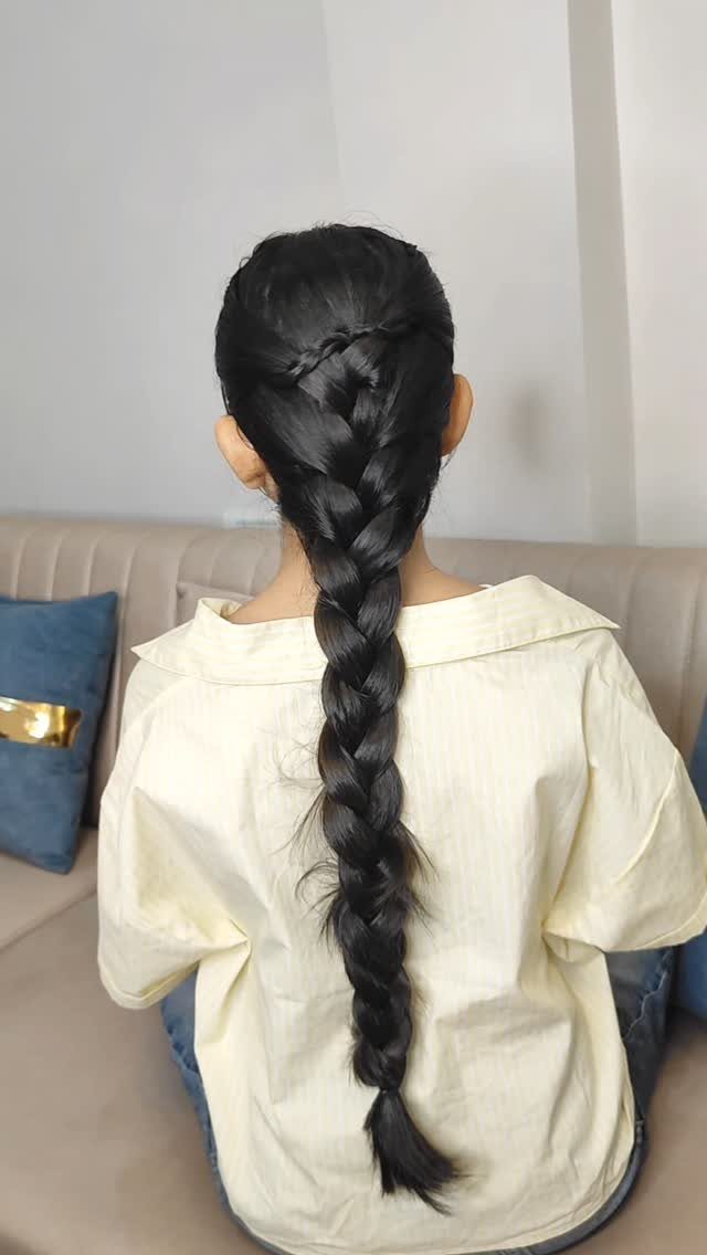20 Thick Natural Hairstyles for Every Length and Mood 18 Long black hair styled in a thick single braid seen from behind.