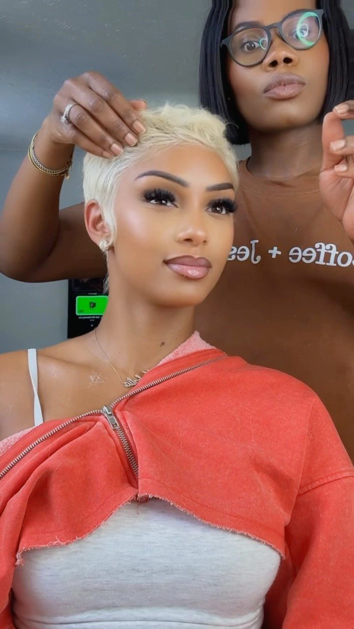 27 Trending Black Hairstyles, from Microbraids to Sisterlocks 12 Woman with a short bleached blonde pixie cut being styled by a professional.