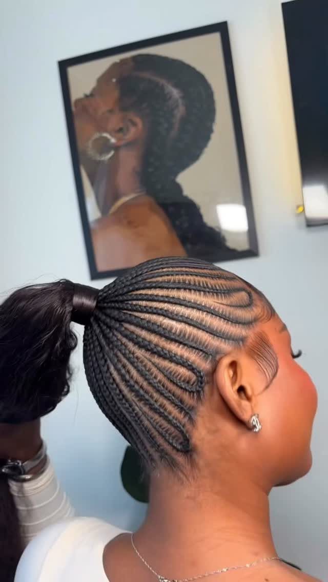 27 Trending Black Hairstyles, from Microbraids to Sisterlocks 24 Woman with wavy cornrows styled into a high ponytail in a side profile.