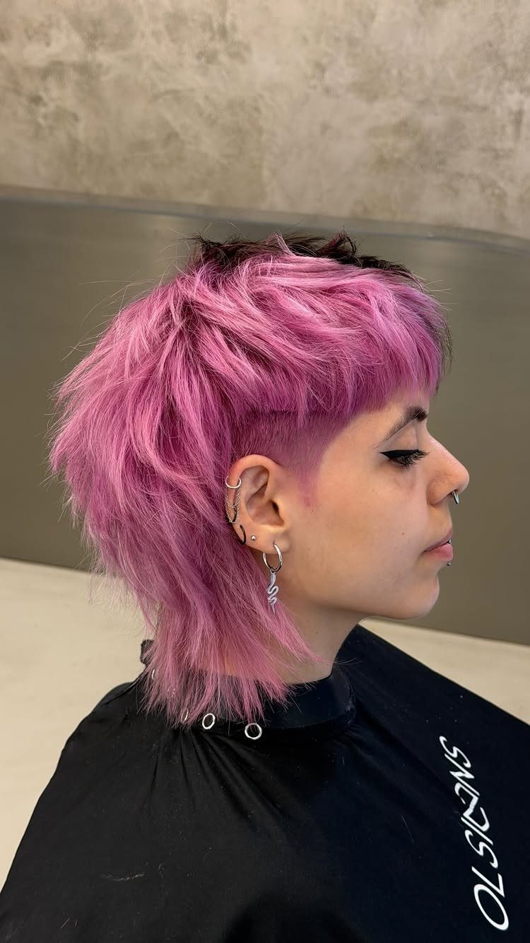 13 Trending Hair Style Ideas, from Curtain Bangs to Pixies 13 Person with a choppy, bright pink textured haircut and dark roots in profile.
