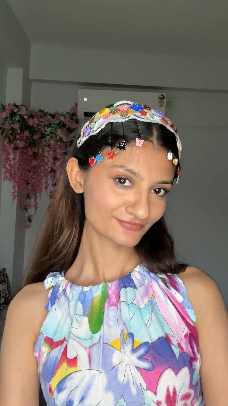 13 Trending Hair Style Ideas, from Curtain Bangs to Pixies 10 Woman wearing a decorative embellished headband and butterfly clips in her brown hair.