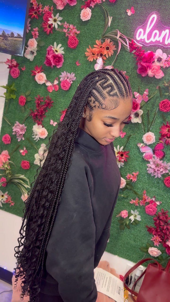 19 Tribal Braids with Boho Ideas, From Bobs to Buns 6 Woman with long black bohemian braids and geometric cornrow patterns on her scalp.