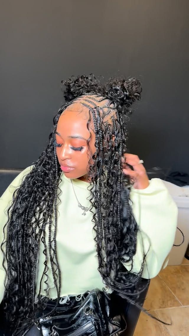 19 Tribal Braids with Boho Ideas, From Bobs to Buns 13 Woman with long black bohemian feed-in braids and two curly space buns.