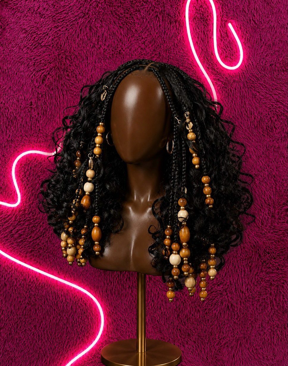 19 Tribal Braids with Boho Ideas, From Bobs to Buns 12 Black bohemian braids with curly ends and wooden beads on a mannequin head.