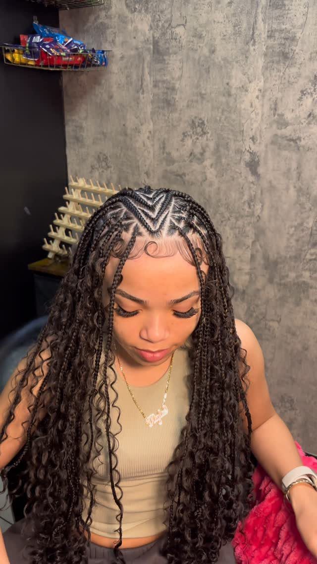 19 Tribal Braids with Boho Ideas, From Bobs to Buns 19 Woman with dark boho braids and intricate tribal parting patterns on her scalp.