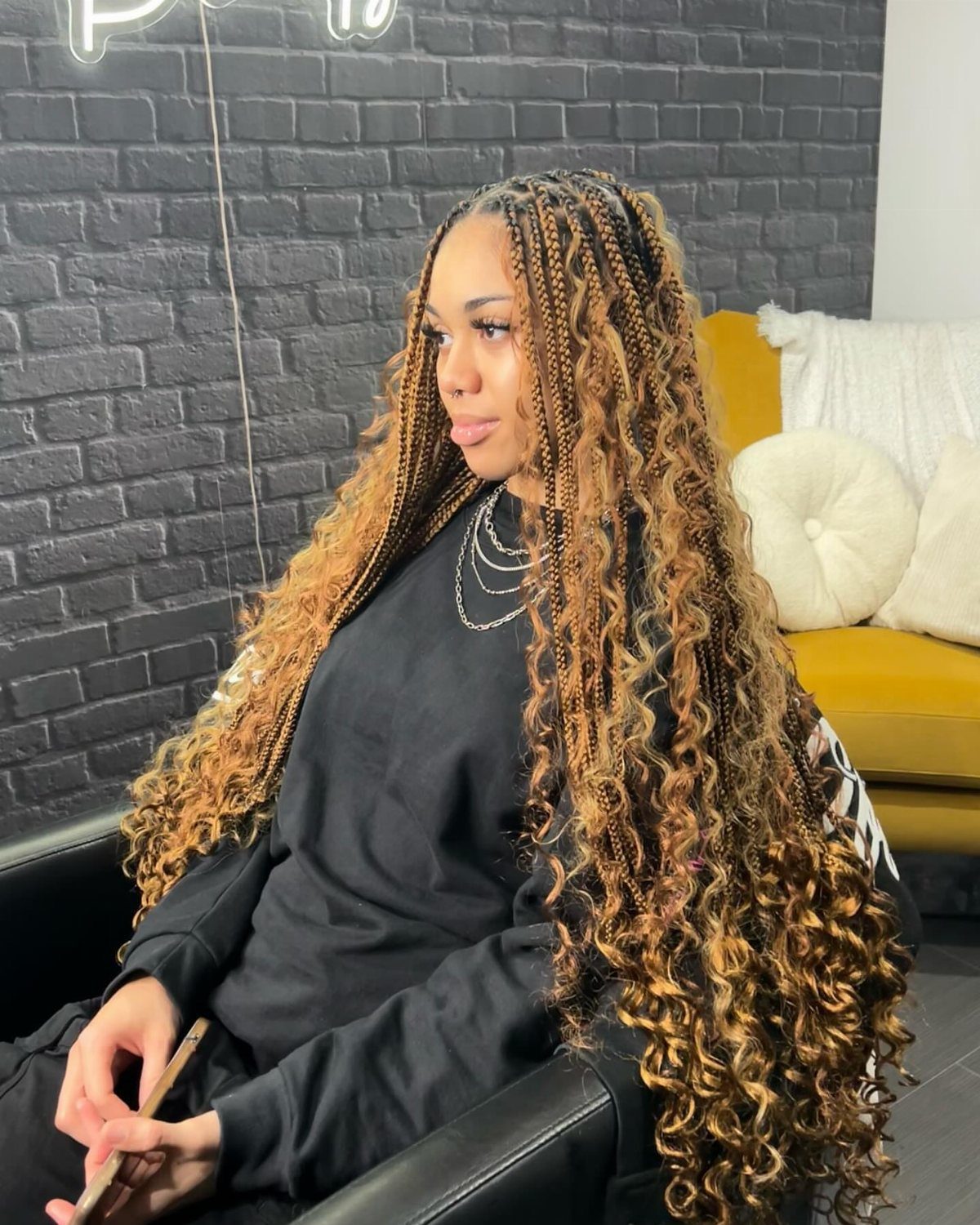 19 Tribal Braids with Boho Ideas, From Bobs to Buns 11 Woman with long honey-blonde goddess bohemian box braids and curly loose ends.