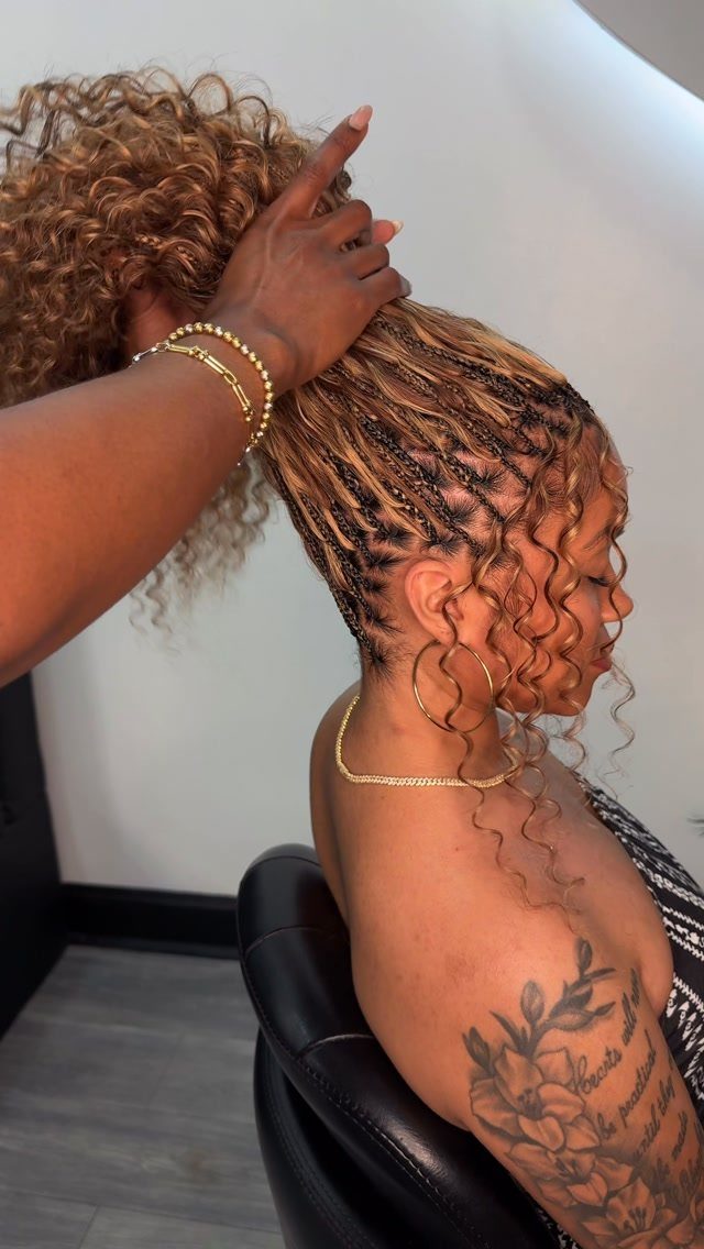 19 Tribal Braids with Boho Ideas, From Bobs to Buns 17 Woman with honey-blonde tribal braids and curly boho ends in a salon chair