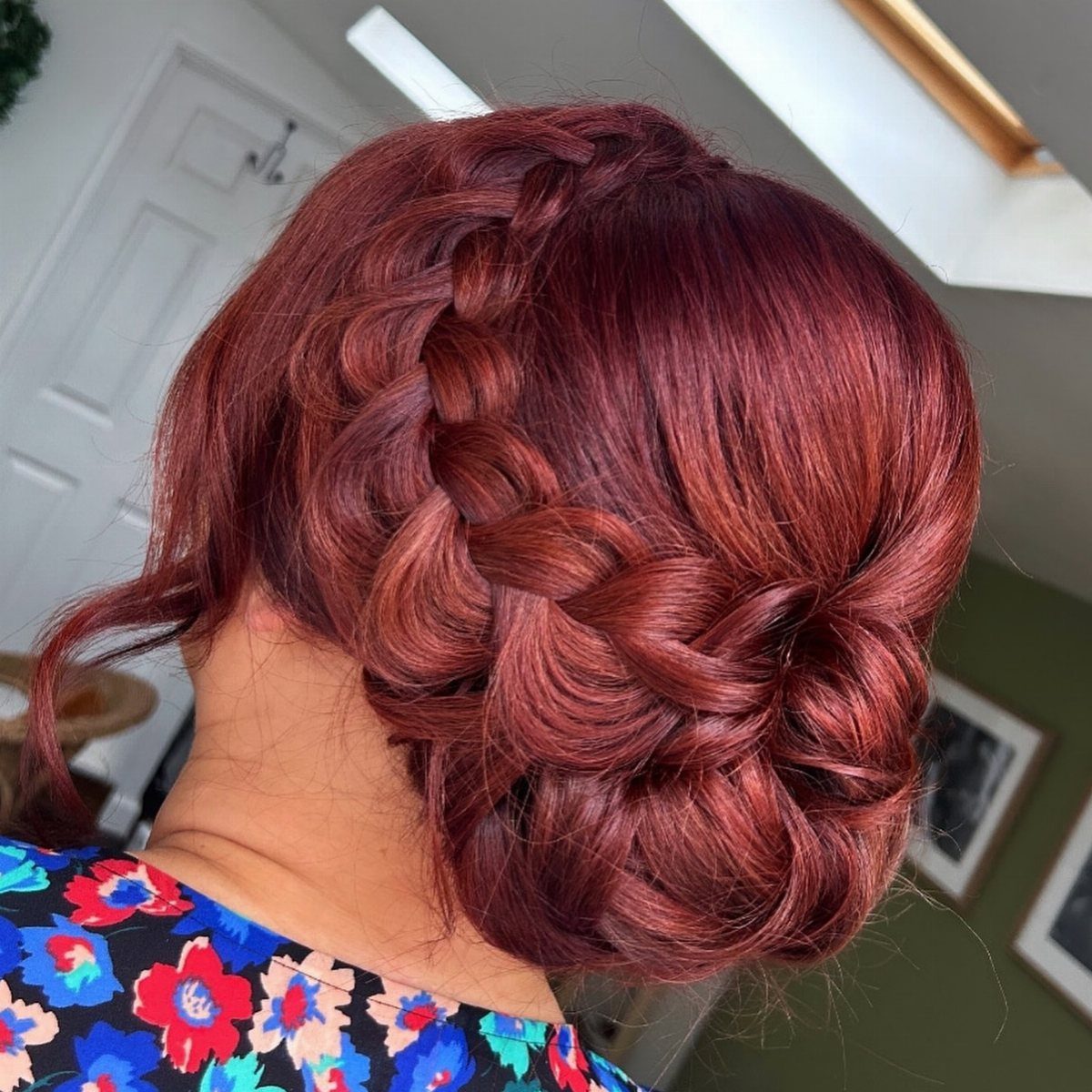 11 Updo Hairstyles for Casual Days and Easy Weekends 6 Reddish-brown hair styled in a thick chunky braid wrapped into a low bun