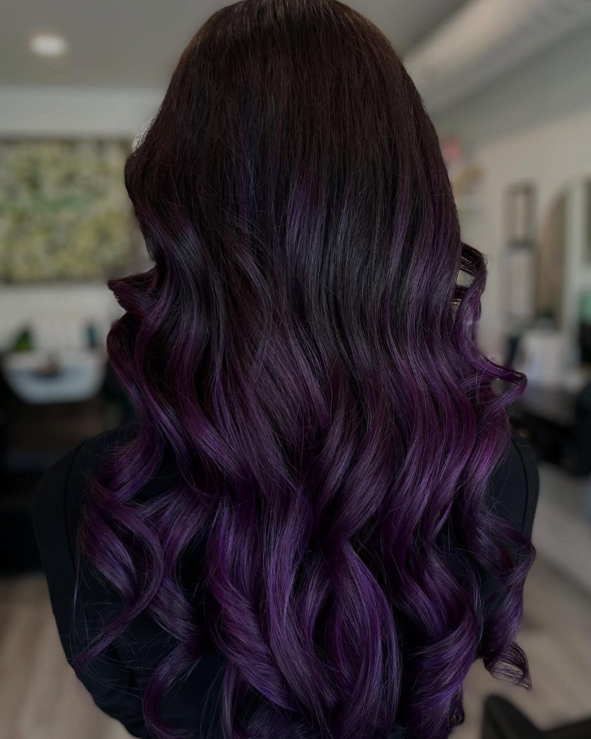 10 Violet Burgundy Hair Ideas for Dark to Bright Looks 2 Long wavy hair with a gradient from dark burgundy to vibrant violet purple.