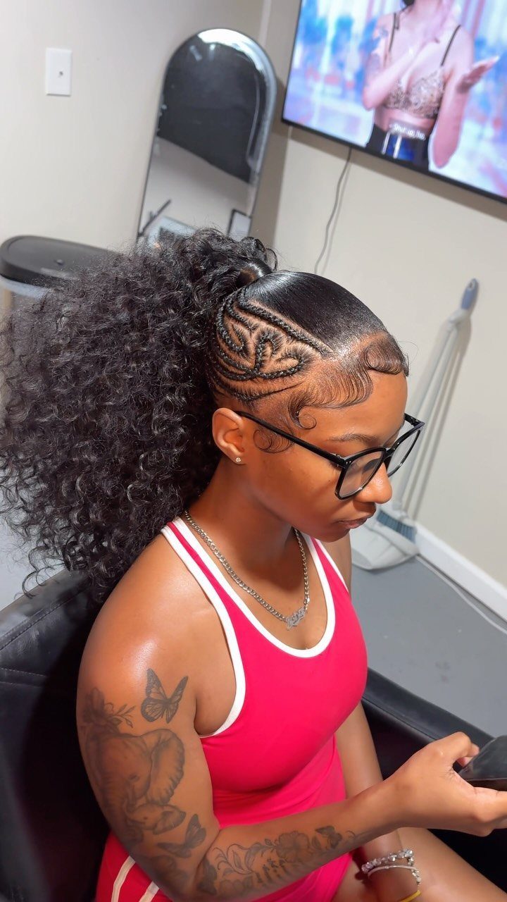 Y2K Braid Hairstyles: 9 Ideas From Butterfly Clips to Cornrows 7 Woman with a high curly half ponytail and intricate braided side patterns.